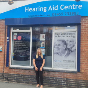 Poppy Knott in font of Hear4U clinic embarking on exciting career path.