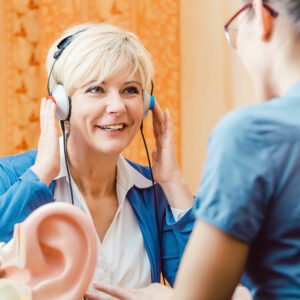 Middle-aged woman undergoing a hearing test
