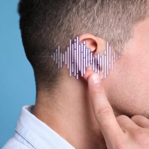 Man pointing to his ear; low-frequency hearing aids waves