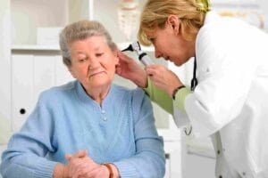 Doctor checking patient’s ear