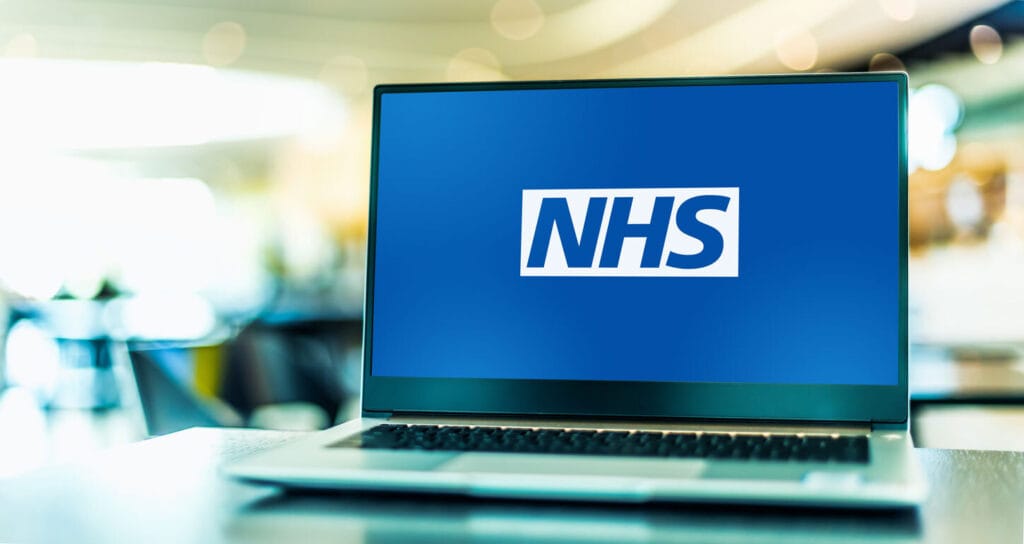 Laptop with NHS logo on the screen