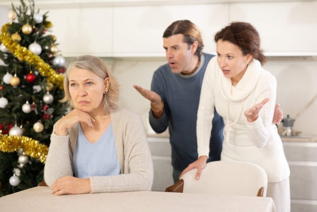 A old lady sitting while her kids trying to talk but being unheard