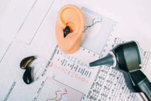 hearing test report with otoscope, hearing aids setup for hearing test and better hearing.